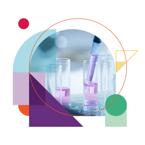 A researcher adding drops of liquid to a test tube using a micropipette.